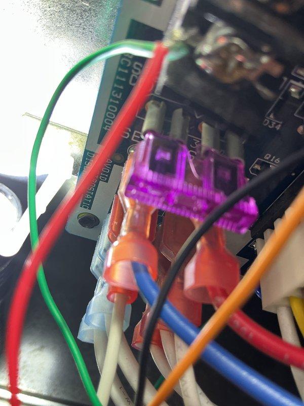 # HVAC Service Report - No Cool Condition

## System Information
Carrier furnace/HVAC system located in basement utility closet, less than 10 years old.

## Problem Reported
System displaying fault malfunction code 24, no cooling operation.

## Diagnostic Findings
Upon arrival, confirmed system was displaying error code 24 on control board. Inspected Carrier unit and associated components in basement mechanical room. Visual inspection revealed blown fuse on main control board. Examined circuit board wiring connections and identified compromised fuse in purple automotive-style holder with multiple wire terminations using push-in connectors.

## Work Performed
- Verified system malfunction code 24 on control board
- Performed visual inspection of furnace and air handler components
- Identified blown fuse on electronic control board
- Replaced defective fuse in circuit board fuse holder
- Verified proper wire connections at control board terminal points
- Tested system operation following