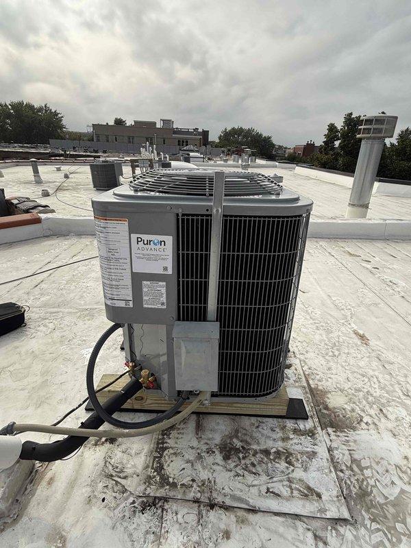 # HVAC Complete System Replacement

Completed full HVAC system replacement including furnace, condenser unit, evaporator coil, and thermostat. Removed existing equipment and installed new Puron-compatible condenser unit on rooftop with proper mounting and leveling. Ran new refrigerant lines and made all necessary connections to ensure proper system operation. Installed new evaporator coil and made all required ductwork modifications for optimal airflow. Replaced thermostat with new unit and verified proper communication with heating and cooling equipment.

Performed system startup procedures including refrigerant charge verification, pressure testing, and leak detection using digital manifold gauges. Measured system pressures showing 35.5 psi on low side with proper superheat and subcooling readings. Conducted full operational test of heating and cooling modes to confirm proper cycling and temperature control. Verified all electrical connections, condensate drainage, and safety control