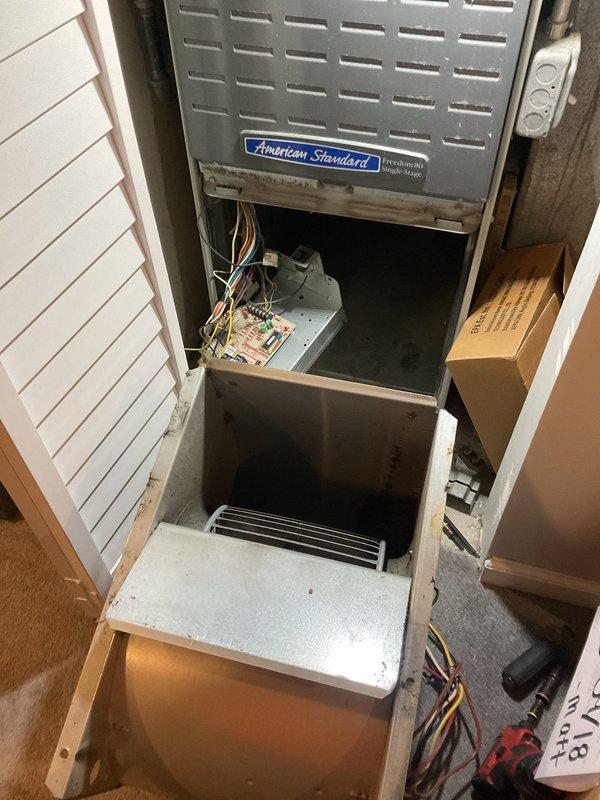 Replaced failed blower wheel assembly on American Standard Freedom single-stage furnace. Removed old blower wheel showing significant dust accumulation and operational wear, installed new replacement unit, and verified proper airflow and system operation upon completion.