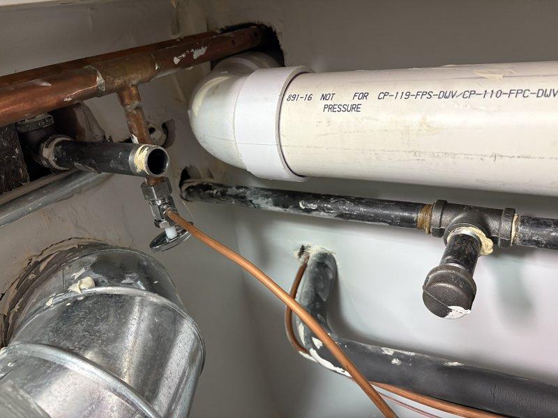 Performed HVAC equipment estimate for downstairs furnace replacement. Unit is a 2017 model with easy access for installation. Assessed existing mechanical system including PVC venting, copper gas line connections, and clearance measurements for new equipment installation. Documented current configuration showing white PVC exhaust piping, corrugated flexible conduit, and existing ductwork connections. Measured available clearance space beneath unit, confirming adequate room for replacement equipment per manufacturer specifications and code requirements. Photographed existing plumbing connections, gas lines, and ventilation components to ensure proper sizing and compatibility with replacement unit.