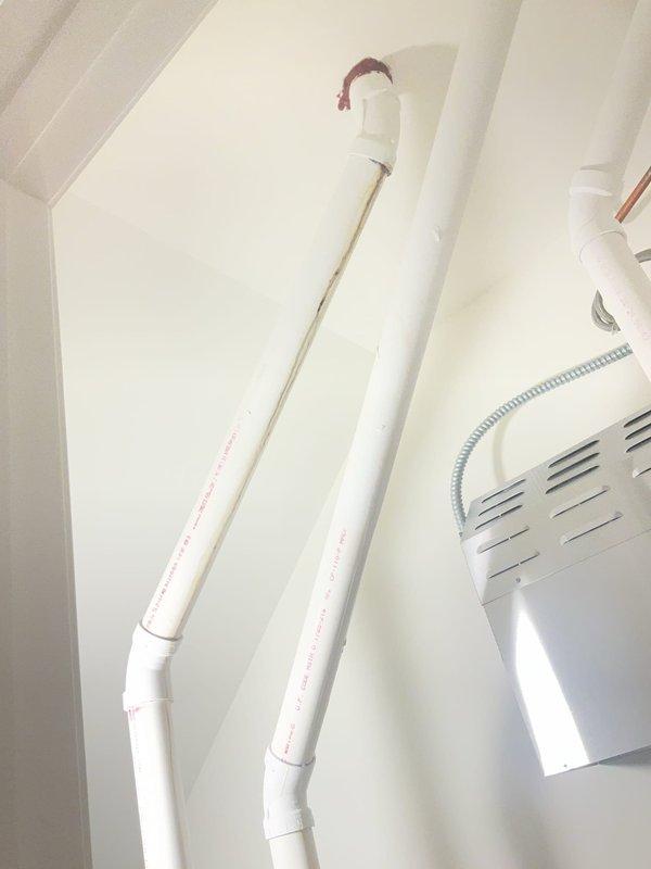Completed comprehensive plumbing inspection of residential property including four full bathrooms and all accessible plumbing systems. Inspected attic-level PVC drainage and ventilation piping, verifying proper installation of vertical waste stacks, elbow joints, and coupling connections. Examined basement mechanical room plumbing infrastructure including main drainage lines, water heater connections, and all visible supply and waste piping for leaks, proper support, and code compliance. All systems found to be functioning properly with no immediate repairs required.
