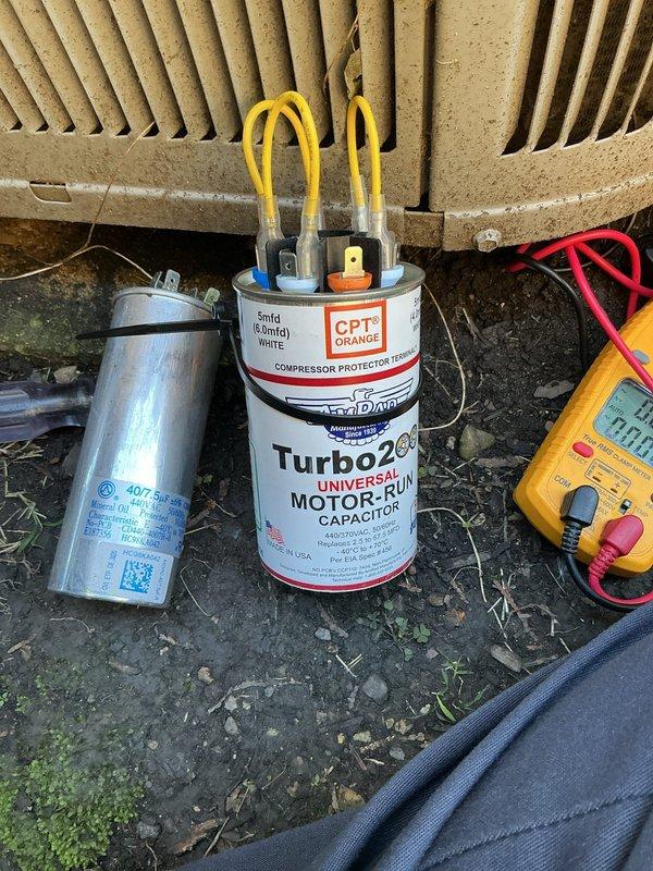Responded to no cooling complaint on residential air conditioning system. Upon arrival, diagnosed failed run capacitor preventing compressor operation. Replaced defective capacitor with Turbo 200 universal motor-run capacitor, verified proper electrical connections, and tested system operation. Unit restored to normal cooling function with satisfactory temperature readings confirmed via infrared thermometer.