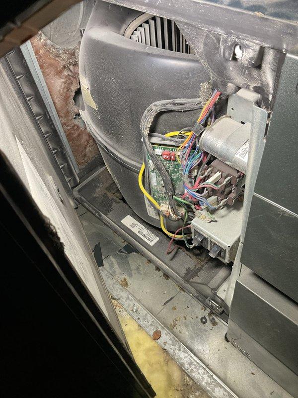 Responded to no cooling complaint on air handler unit located in attic space. Upon inspection, discovered active water leak from drain pan causing system malfunction. Removed access panel to assess internal components and verified blower assembly and electrical controls were operational. Cleared condensate drain line obstruction and treated with algaecide tablets to prevent future blockages. Confirmed proper drainage flow and verified system returned to normal cooling operation with no further leakage detected.