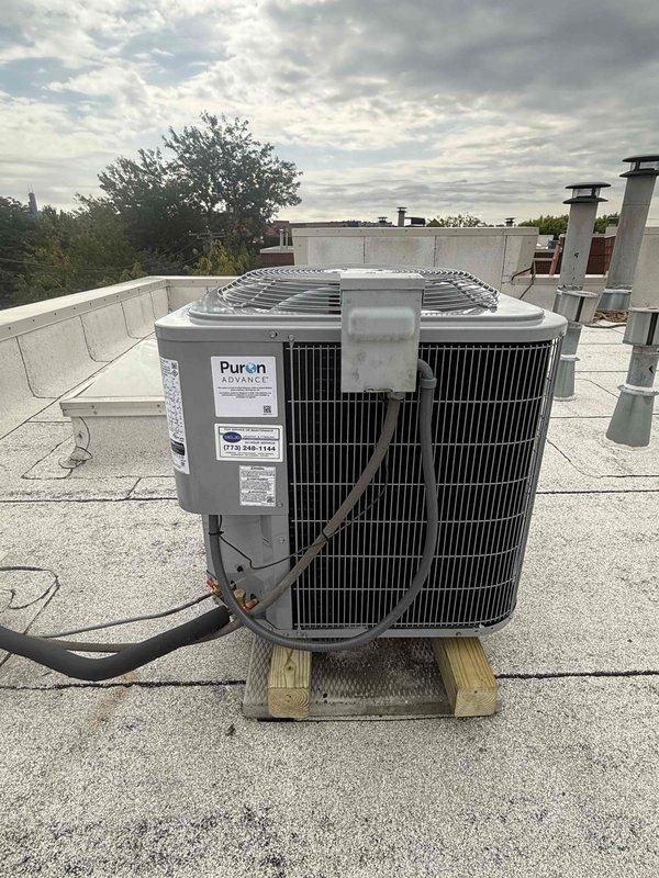 Completed rooftop air conditioning system replacement involving condenser unit and evaporator coil installation. Removed existing equipment and installed new condenser on elevated wooden platform with proper leveling and stability. Connected refrigerant lines, verified electrical connections, and mounted unit on commercial roofing membrane with appropriate clearances from parapet wall and roof penetrations. Installed new evaporator coil in air handler, performed system startup, and utilized digital diagnostic equipment to verify proper operation and refrigerant charge levels.