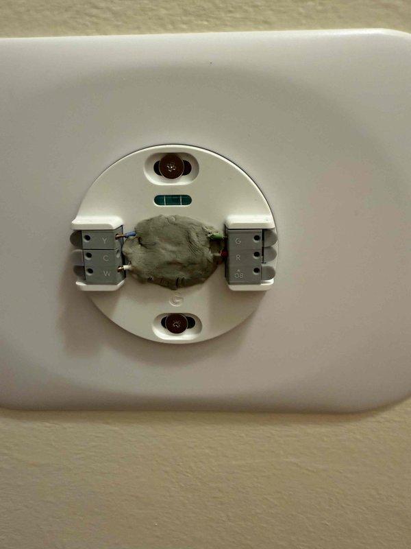Responded to callback for Nest thermostat displaying N262 error message indicating wire fault on previously installed customer-provided unit. Inspected thermostat wiring connections at wall plate and traced circuits to Carrier furnace system, verified proper wire terminations at both thermostat base and equipment, tested voltage at R and C terminals, and confirmed system restored to proper operation with error code cleared.