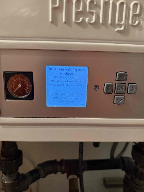 Responded to callback for radiant heating system not operating. Upon arrival, found Prestige boiler displaying "Flame failure during start-up phase" error on control panel LCD screen. Diagnosed ignition failure, cleared error code, tested unit startup sequence, and verified proper combustion and flame detection. Inspected condensate drainage system and exterior venting to ensure proper operation, then confirmed radiant heating system restored to normal function.