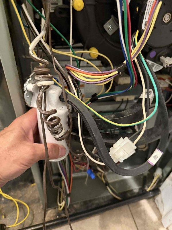 Responded to callback for AC unit continuing to short cycle after previous warranty control board and thermostat replacement. Inspected control board wiring and connections, verified proper installation of replacement board (Software ID 0160-0548 V.04), and documented internal wiring configuration and board mounting assembly. All wire terminations at control board terminal block confirmed secure with proper color coding intact. Equipment photographed for warranty documentation purposes.