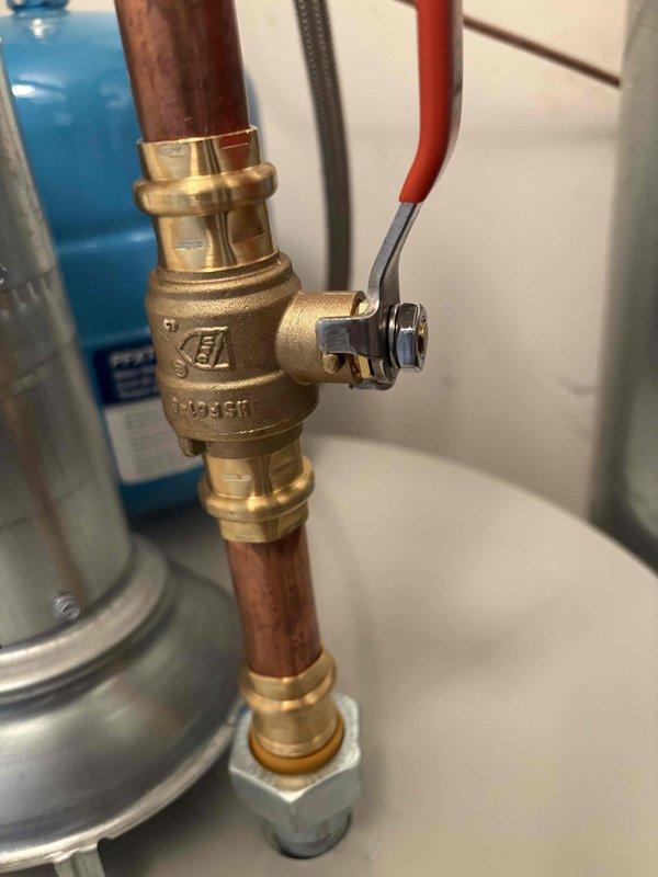 Installed a 50-gallon Bradford White tanked water heater with all necessary plumbing connections, including brass ball valves and copper piping with press-fit fittings. Added an expansion tank to the system and installed a new emergency drain pan beneath the unit for overflow protection. All connections were pressure-tested and verified operational upon completion.