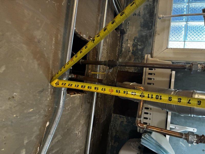 Conducted on-site assessment for water heater replacement due to active leak. Performed detailed measurements of existing equipment and surrounding ductwork to determine proper sizing and clearances for new unit installation. Documented current conditions including mechanical room layout, existing piping configuration, and ventilation components to prepare comprehensive replacement estimate.