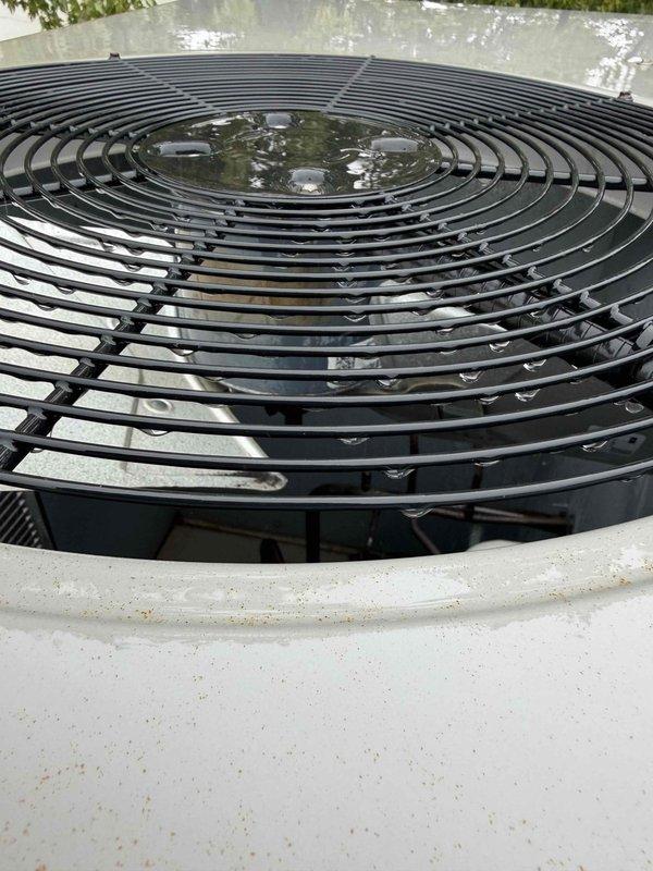 Responded to no cooling call with reported loud noise from rooftop packaged HVAC unit. Upon arrival, inspected 6-year-old air handler and rooftop RTU installation. Performed diagnostic assessment of unit operation, examined fan assembly and motor components through top grille access. Evaluated condenser fan guard, motor mounting, and internal components for abnormal wear, debris, or mechanical issues causing excessive noise. Documented equipment condition with photos showing rooftop unit placement, fan assembly configuration, and overall system installation for service records.