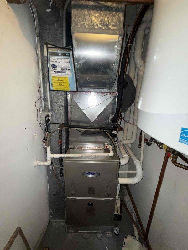 Performed comprehensive maintenance on two furnaces and humidifier system as part of ongoing service agreement. Replaced 16x25x1 air filter and installed #35 water panel for humidifier to ensure optimal air quality and humidity control. Conducted thorough inspection of HVAC installation including furnace units, air handler, PVC condensate drainage lines, electrical connections, and ductwork components. Examined blower assembly and verified proper operation of centrifugal fan with clean blades and housing showing normal condensation patterns, confirming system functionality and readiness for continued service.