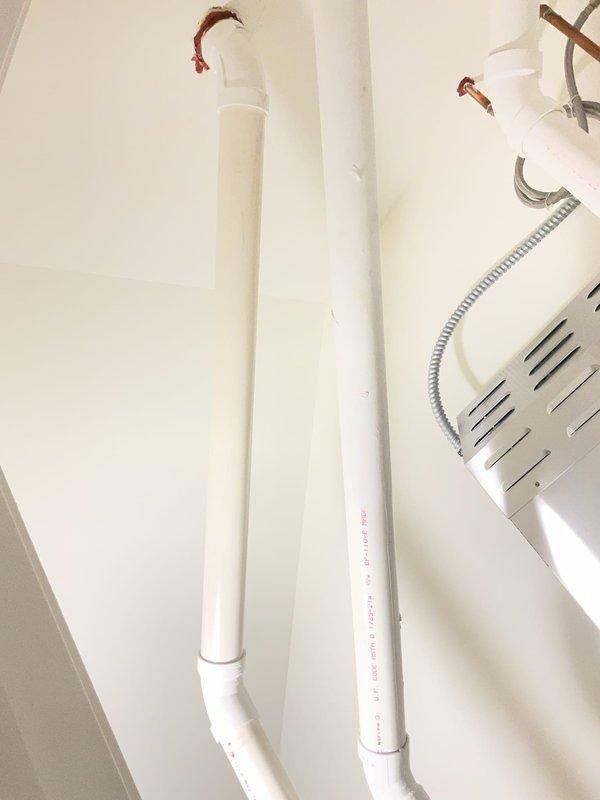 Completed return visit for PVC drain line repair in utility room. Repaired and secured vertical PVC drainage piping with proper fittings and joints, ensuring proper alignment and connection integrity throughout the system.