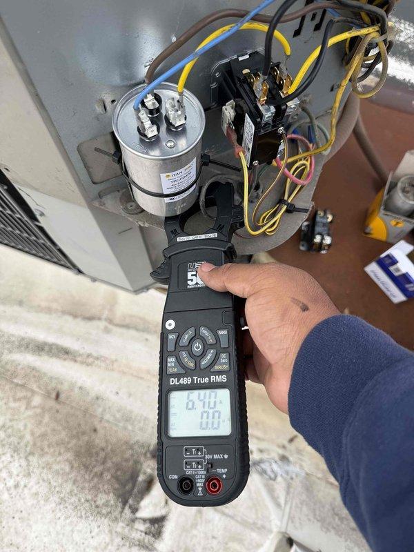 Responded to A/C breakdown on commercial rooftop unit. Upon arrival, performed electrical diagnostics using digital multimeter to test system components. Testing revealed failed capacitor requiring replacement. Installed complete breakdown kit including new dual-run capacitor and contactor assembly. Verified proper voltage readings and electrical connections throughout system. Tested unit operation and confirmed cooling cycle functioning properly. System restored to normal operation.