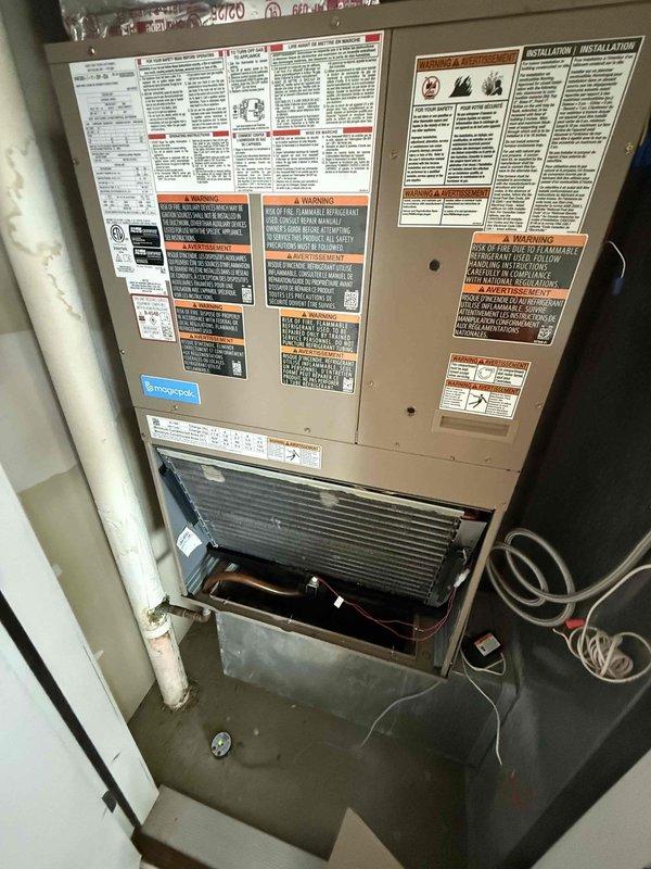 Responded to no cooling complaint on 9-year-old MagicPak unit installed in July. Diagnosed intermittent power loss affecting condenser operation and wet switch sensor, along with "no power to R wire" error at Nest thermostat. Inspected electrical connections and wire terminations at unit, finding loose connections at low-voltage terminal block causing intermittent power interruptions. Secured all wire connections using proper wire nuts and verified continuity on R wire circuit to thermostat. Addressed standing water in condensate pan by clearing partial blockage in drain line and confirming proper wet switch operation. Cycled system through multiple cooling cycles to verify consistent power delivery to all components and confirmed condenser now running continuously without interruption. Thermostat displaying proper power status and unit operating normally at departure.