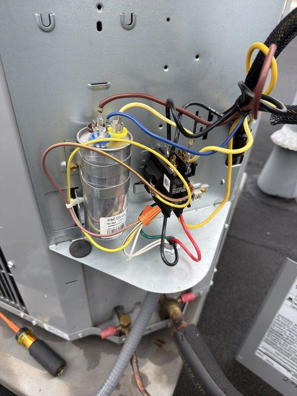 Responded to callback for non-operational AC unit following recent electrical work performed by previous technician. Upon inspection, verified proper capacitor installation and electrical connections within the air handler cabinet, confirmed refrigerant line integrity at rooftop condenser unit, and tested system operation to resolve ongoing cooling failure reported by customer.