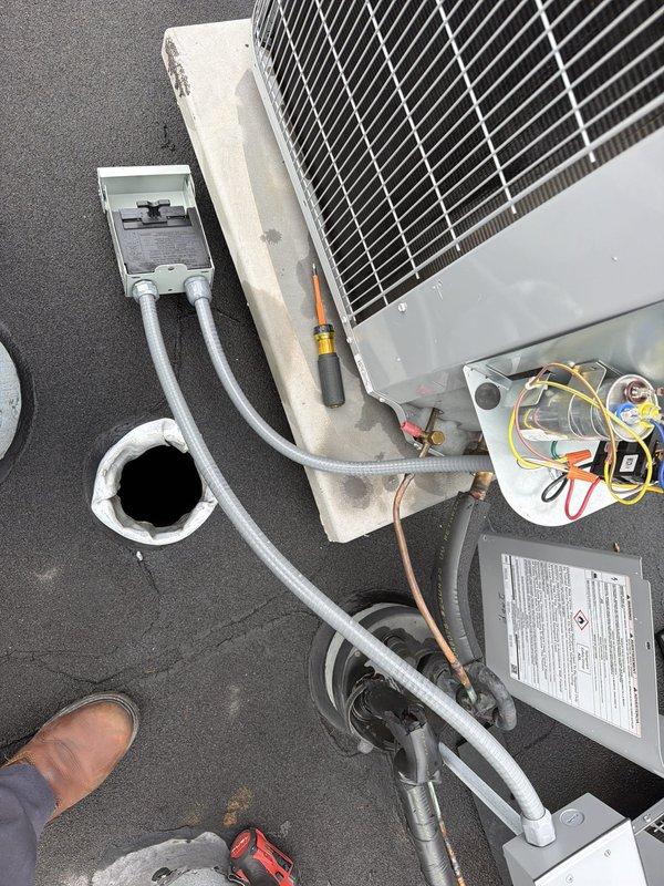 Responded to callback for non-operational AC unit following recent electrical work performed by previous technician. Upon inspection, verified proper capacitor installation and electrical connections within the air handler cabinet, confirmed refrigerant line integrity at rooftop condenser unit, and tested system operation to resolve ongoing cooling failure reported by customer.