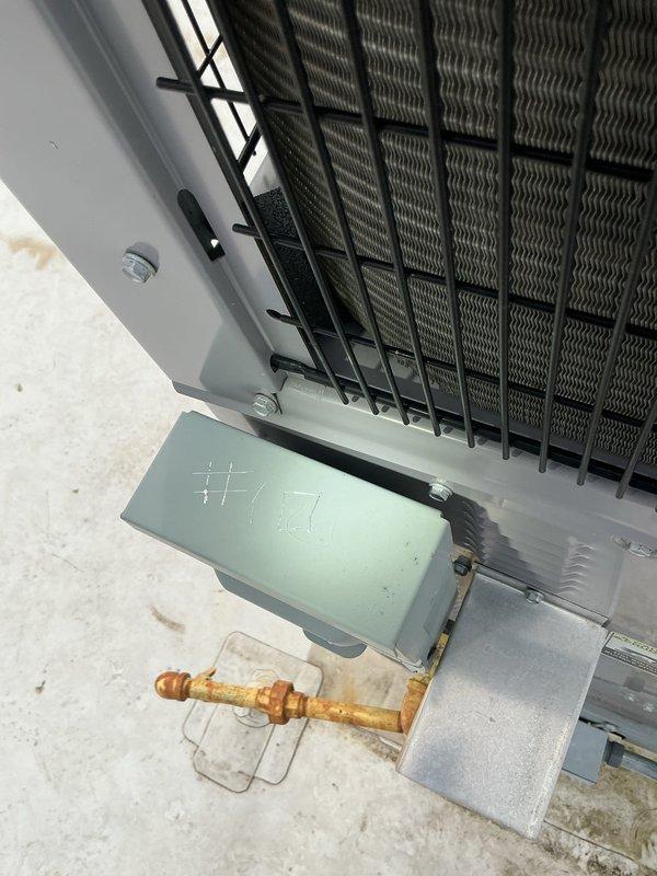 Completed comprehensive heating maintenance on commercial rooftop unit #1 per agreement terms. Performed thorough inspection of heating components, electrical connections, and gas-fired sections. Documented equipment condition with interior cabinet access revealing operational coil assembly, capacitor, and control box with proper safety labeling intact. Exterior inspection showed weathered copper refrigerant lines with oxidation and unit mounted on concrete pad with standard environmental wear. All heating components found operational and system left in serviceable condition.