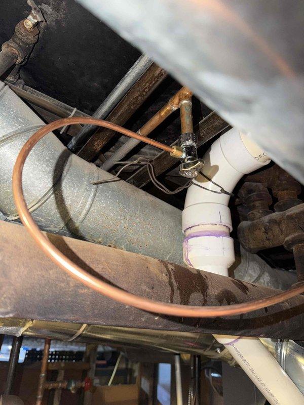 Completed comprehensive maintenance agreement inspection covering one boiler, one furnace, and one air conditioning unit. Inspected crawlspace mechanical components including copper refrigerant lines, PVC drainage systems, and ductwork, noting age-related oxidation on metal components but all systems operating within normal parameters. Examined condensate drain pan showing wear and coating deterioration; documented condition with photographs for maintenance records. All equipment tested and found operational with no immediate service requirements identified during this preventive maintenance visit.