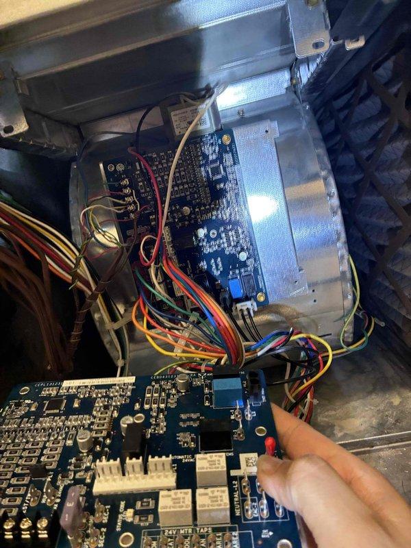 Returned to complete circuit board replacement on HVAC control system. Removed failed control board and installed new replacement PCB with integrated circuits, connectors, and 24V motor tap connections. Verified all wire terminations to terminal blocks, confirmed proper seating of multi-pin connectors, and tested system operation upon completion.