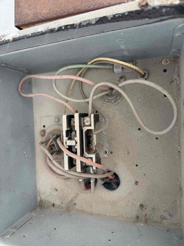 Completed comprehensive maintenance agreement service on both heating and air conditioning systems. Accessed outdoor unit using 12-foot ladder to perform inspection and cleaning. Inspected flame sensor, noting carbon buildup and corrosion on the probe tip requiring cleaning for optimal ignition performance. Examined outdoor unit electrical components including contactor and wiring connections within weathered enclosure. Verified all wire terminations secure despite visible age and environmental exposure to outdoor elements. Provided Certificate of Insurance to HOA as requested prior to service appointment. Documented system conditions with photographs for maintenance records.