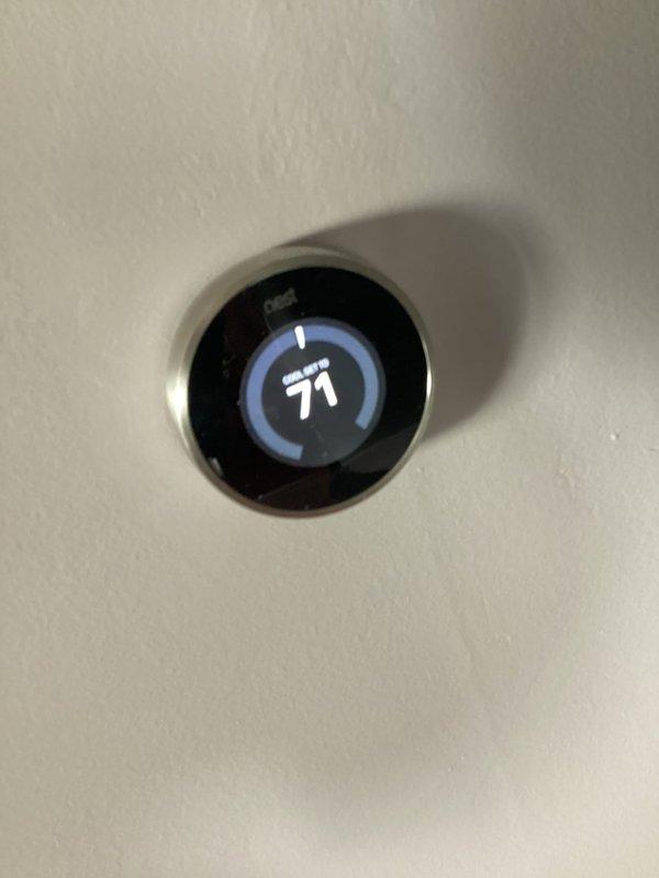 Completed comprehensive heating system tune-up and maintenance inspection at residential condo unit. Verified thermostat operation and calibration with unit heating to setpoint of 71 degrees, inspected floor register and return air grille, and performed standard preventive maintenance procedures on HVAC equipment including filter assessment and system controls verification.
