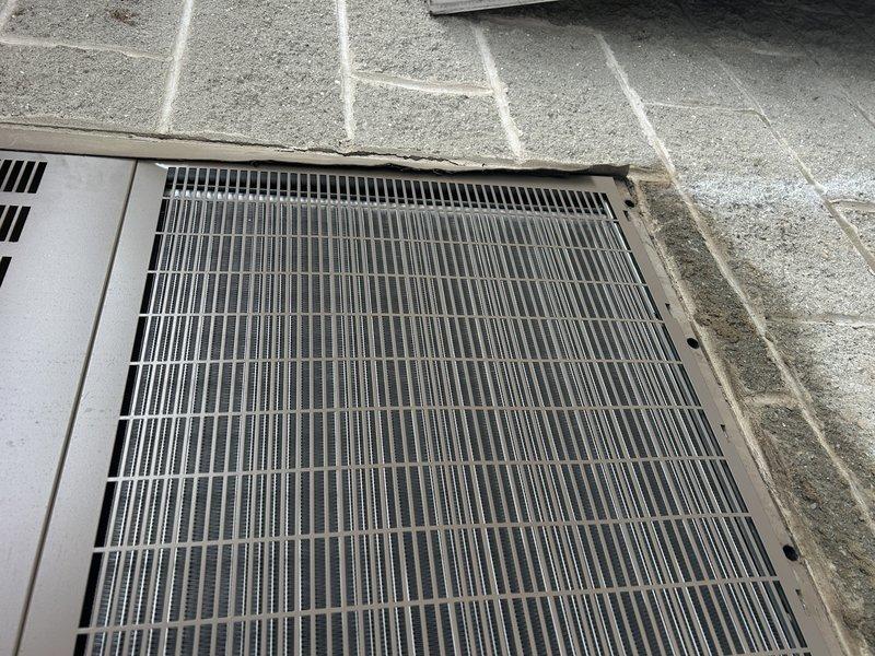 Responded to callback for HVAC installation experiencing continuous operation and water leakage. Inspected outdoor condensing unit and ventilation components, documented current condition with photos showing properly mounted equipment and grilles in functional condition. Addressed operational issues to restore system to normal cycling and eliminate water discharge problem.