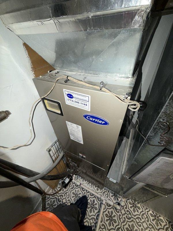 Completed comprehensive maintenance on Carrier air handler unit located in attic space, including fan coil, heat strip, and humidifier system. Performed standard inspection and cleaning procedures on all components, verified proper operation of humidifier with cylindrical canister attachment, and confirmed 14x20x1 filter specification. All equipment tested and found operating within normal parameters upon completion of maintenance agreement service.
