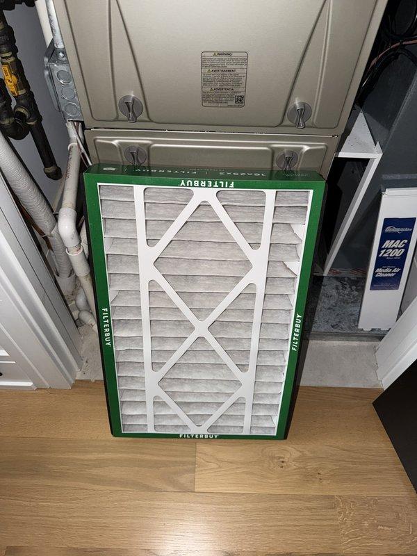 Completed preventive maintenance agreement service on residential HVAC system with dual condensers. Inspected and serviced both outdoor condensing units, replaced air filter at furnace, and verified thermostat operation showing proper temperature control at 72°F room temperature. All equipment found operating within normal parameters.