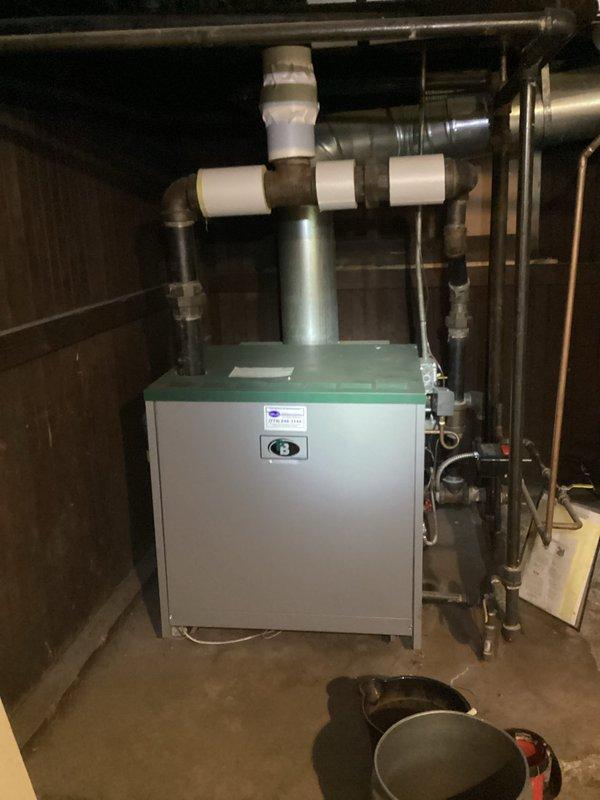 Completed scheduled boiler maintenance agreement inspection on residential heating system. Performed comprehensive visual inspection of boiler unit, verified proper operation of digital thermostat displaying appropriate temperature settings, and examined all associated mechanical components including PVC venting, copper supply lines, and ductwork connections. All equipment found to be operating within normal parameters with no immediate service needs identified. Documentation photos captured for maintenance records.