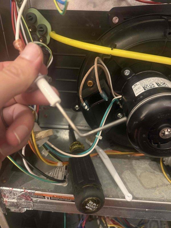 Performed comprehensive HVAC maintenance agreement service including furnace and humidifier inspection. Investigated reported malfunction of water sensor triggering false alarms. Inspected blower wheel assembly and motor components, verifying proper operation and cleaning accumulated dust and debris from critical components. Examined electrical connections and wiring throughout the unit, checking terminals and connectors for secure attachment and proper function. Replaced 16x20x1 air filter. Documented equipment condition through detailed photography of blower assembly and electrical components for service records.