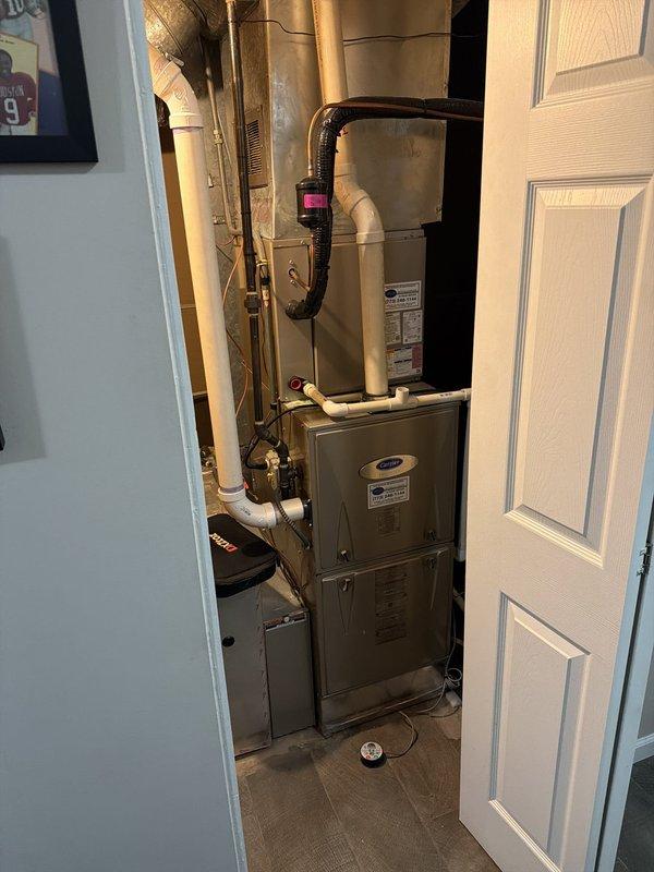 Responded to no-power condition on Ecobee thermostat controlling a 9-year-old Carrier HVAC system. Inspected thermostat at wall location and verified complete loss of power to display. Checked 24V transformer output at air handler, confirmed proper voltage supply, and traced common wire connection from thermostat to equipment. Identified loose or failed C-wire connection at air handler terminal block. Secured common wire connection, restored power to thermostat, and verified proper system communication and cooling operation.