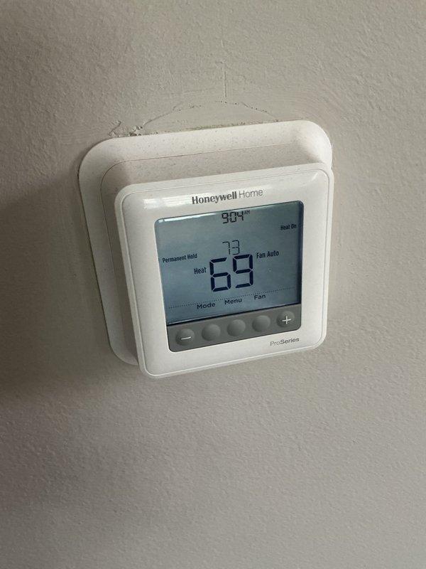 Completed cooling and heating maintenance agreement service on furnace and humidifier system. Replaced 16x25x1 air filter and #10 humidifier pad to ensure optimal system performance and air quality. Performed comprehensive system diagnostics including electrical testing of blower motor components using multimeter to verify proper operation. Verified thermostat functionality showing system operating in heating mode with proper temperature control and display readings. Collected annual maintenance agreement renewal payment and documented all service activities with photographic records.