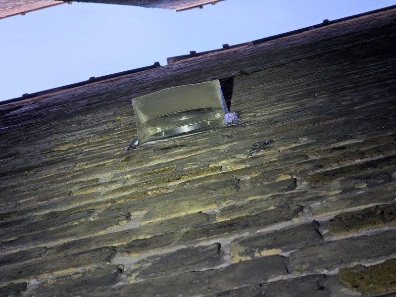 Completed warranty service to connect kitchen hood exhaust ductwork to exterior wall termination. Installed exterior vent cap through wood siding and verified proper measurements for interior ductwork connection at ceiling level. Documentation photos captured of exterior penetration point and interior vertical duct run measurements to ensure proper installation specifications.