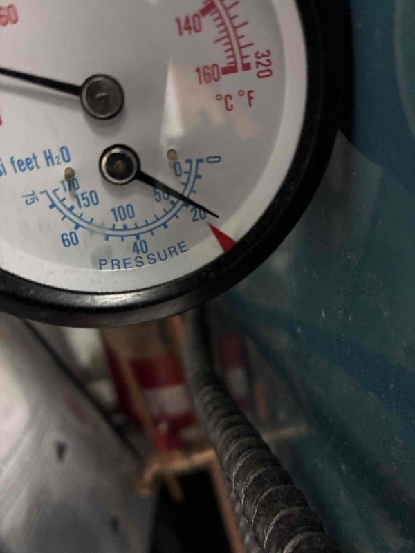 Responded to no heat call on boiler system. Upon inspection, found water flow to boiler blocked by debris accumulation and internal rusting in supply line. Cleared blockage to restore proper water circulation to unit. Identified missing backflow preventer on water supply connection, which is required for code compliance and system protection. Documented equipment specifications and current operating pressures. Recommended installation of backflow prevention device to prevent contamination of potable water supply and ensure system meets local plumbing codes.