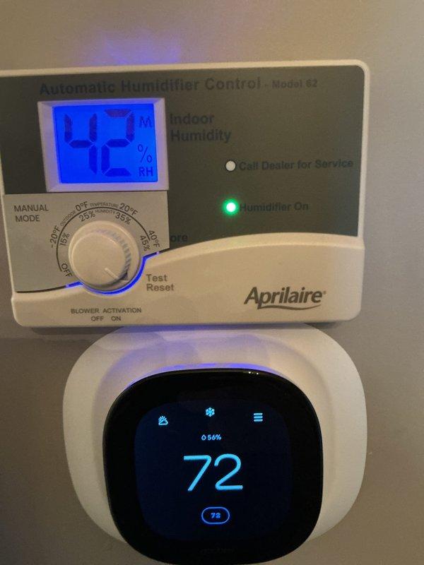 Performed HVAC maintenance agreement service call for humidification system. Replaced steam humidifier canister tank with GS #80 cannister on CC steam humidifier unit. Verified Aprilaire Model 62 Automatic Humidifier Control operation showing proper indoor humidity readings of 42-43% with green indicator light confirming humidifier activation. System operating correctly with thermostat displaying 72°F and coordinating with humidifier control for optimal climate management.