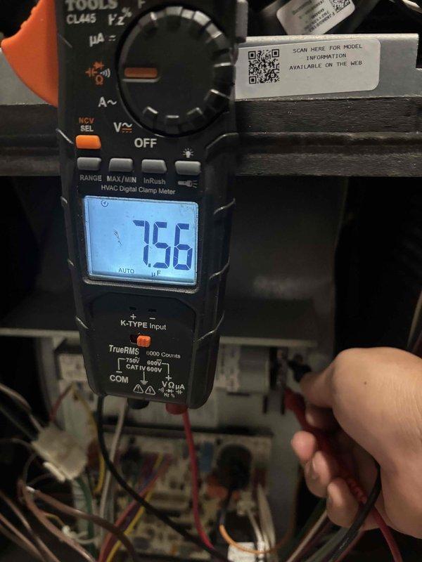 Performed routine maintenance inspection on air conditioning system under maintenance agreement. Conducted electrical diagnostics using digital clamp meter, recording frequency readings at 75.6 Hz to verify proper system operation and power quality. Inspected blower wheel assembly, confirming all radial blades intact with uniform spacing and no signs of damage or excessive wear, ensuring optimal airflow performance for continued efficient system operation.