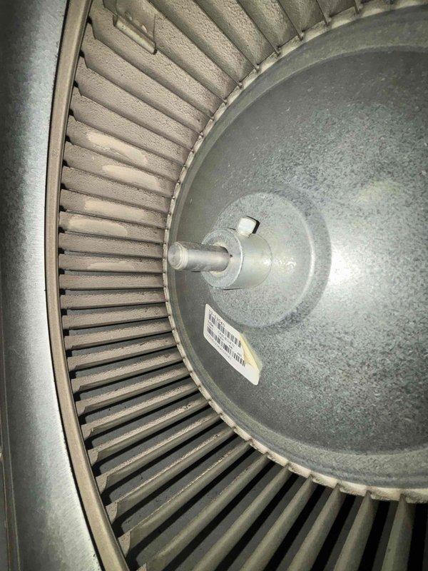 Performed routine maintenance inspection on air conditioning system under maintenance agreement. Conducted electrical diagnostics using digital clamp meter, recording frequency readings at 75.6 Hz to verify proper system operation and power quality. Inspected blower wheel assembly, confirming all radial blades intact with uniform spacing and no signs of damage or excessive wear, ensuring optimal airflow performance for continued efficient system operation.