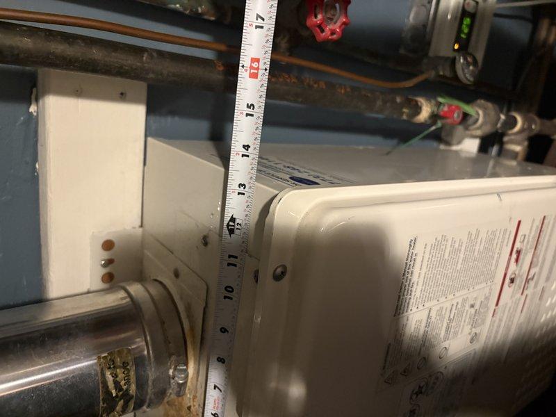 Performed comprehensive assessment of existing 20-year-old Noritz tankless water heater installation in mechanical room. Documented current equipment configuration including exhaust venting system, copper supply piping with shutoff valves, electrical connections, and mounting arrangement. Provided estimate for complete tankless water heater replacement to address age-related concerns and ensure continued reliable operation.