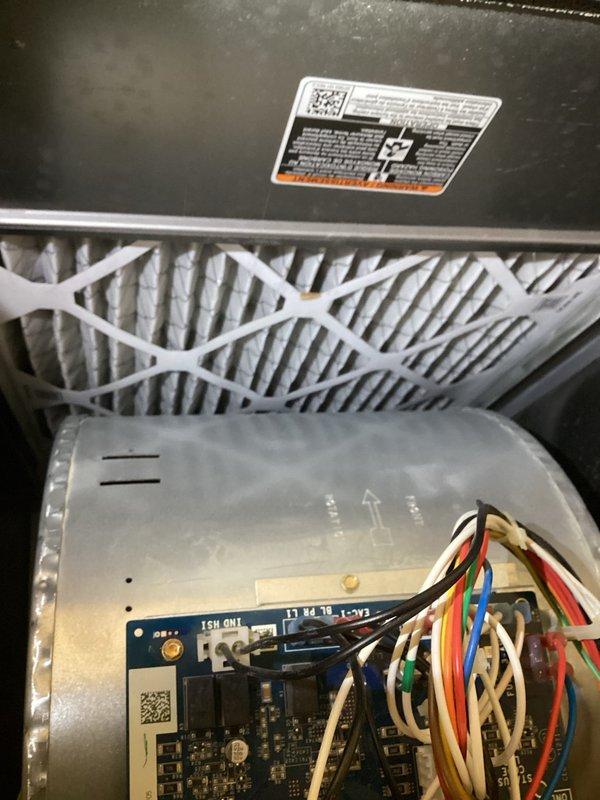 Completed comprehensive maintenance inspection on two furnace systems. Verified thermostat operation displaying 76°F in heating mode, inspected and documented air filter condition showing proper installation, and examined internal components including control board wiring and electrical connections to ensure all systems functioning within normal parameters.