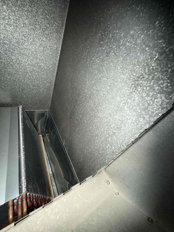 Performed follow-up inspection on 9-year-old air conditioning system after previous coil freeze incident that resulted in water damage. Conducted comprehensive system evaluation including temperature and pressure readings using digital gauges, verified proper refrigerant levels, and inspected evaporator coil assembly and drain pan for any residual issues or blockages. Assessed airflow, checked condensate drainage system functionality, and reviewed operational parameters to identify root cause of previous freeze-up and implement preventative measures to avoid future occurrences.