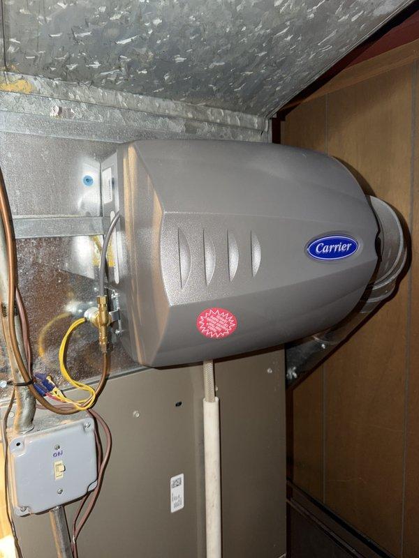 Completed comprehensive maintenance agreement service on Carrier furnace and whole-home humidifier system in basement mechanical area. Performed standard seasonal inspection including filter replacement with 16x25x1 media filter, verified humidifier operation and water supply connections, inspected ductwork connections and electrical components, and documented equipment condition with photographic records. All systems operating within manufacturer specifications with no deficiencies noted.