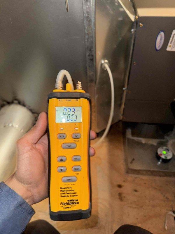 Completed comprehensive HVAC maintenance agreement service including air conditioning, furnace, and humidifier systems. Replaced 16x25x4 media air filters that showed significant dust accumulation, removing old filters from attic installation location. Performed diagnostic testing using digital manometer to measure static pressure readings of 0.23 inches water column, verifying proper system airflow and operation across all equipment.