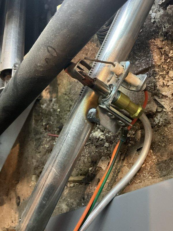 Completed comprehensive maintenance agreement service on GS steam boiler system. Inspected and documented boiler piping infrastructure, including brass valves, galvanized supply lines, and associated mechanical components in utility space. Verified thermostat operation and programming functionality, confirming proper temperature control settings and system communication with heating equipment.