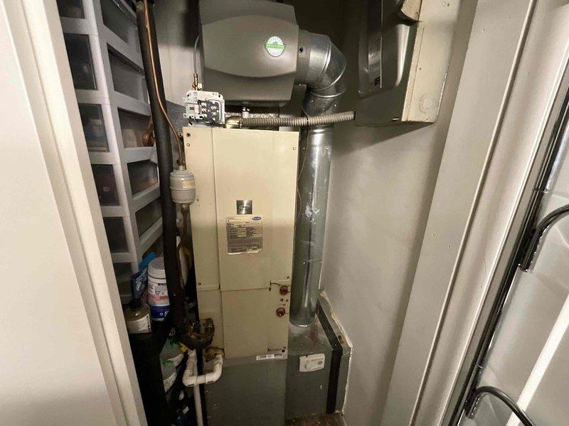 Conducted comprehensive site evaluation for complete HVAC system replacement. Assessed existing indoor air handler unit located in utility closet, documenting current equipment specifications, ductwork configuration including metallic supply plenum with flexible connections, and associated plumbing lines. Evaluated outdoor rooftop condensing unit with visible fan assembly and noted electrical infrastructure including Eaton disconnect boxes and conduit routing. Photographed all equipment, electrical connections, and installation conditions to provide detailed documentation for full system replacement proposal. Provided estimate for new HVAC system installation based on existing configuration and site requirements.