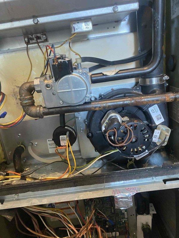 Replaced defective blower wheel and heat exchanger on residential furnace unit. Removed access panels to access internal components, disconnected electrical connections and gas lines, and extracted failed heat exchanger showing signs of deterioration. Installed new heat exchanger assembly and blower wheel, reconnected all gas piping, electrical wiring, and control components. Tested system operation to verify proper airflow and heating function upon completion.