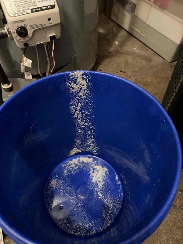 # Tanked Water Heater Repair

Responded to service call for water heater producing knocking noises. Upon inspection, identified an AO Smith ProLine commercial grade unit with date marking of 11-15-22. Diagnosed knocking sounds as sediment buildup causing water hammer effect within the tank. 

Performed tank flush procedure to remove accumulated mineral deposits and sediment from bottom of tank. Inspected all plumbing connections, copper supply lines, and shut-off valves for proper operation. Verified temperature and pressure relief valve functionality. Tested unit operation after service and confirmed elimination of knocking noises. All connections secure and system operating within normal parameters.