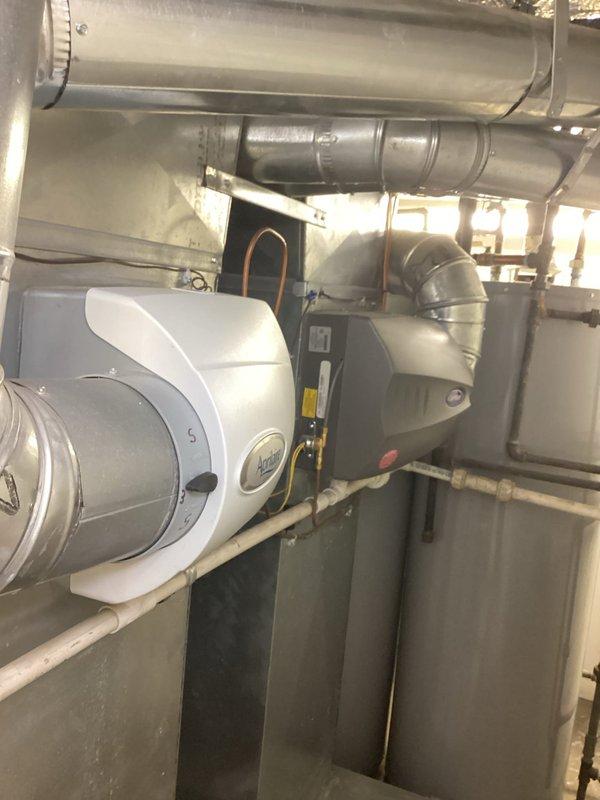 Completed maintenance agreement service on CC boiler, two furnaces, and two Aprilaire humidifiers in basement mechanical room. Doorbell buzzer was non-functional upon arrival, requiring homeowner to provide entry access. Electronic air cleaners were not included in this maintenance visit per agreement terms.