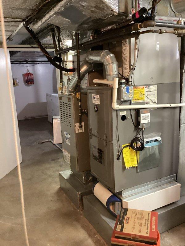 Completed maintenance agreement service on CC boiler, two furnaces, and two Aprilaire humidifiers in basement mechanical room. Doorbell buzzer was non-functional upon arrival, requiring homeowner to provide entry access. Electronic air cleaners were not included in this maintenance visit per agreement terms.