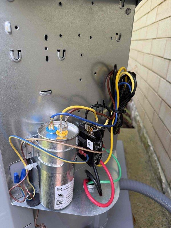 Responded to callback for newly installed AC system with non-operational condenser unit. Upon inspection, identified faulty capacitor preventing condenser from starting. Replaced defective capacitor with properly rated component, verified all electrical connections at both the condenser control panel and exterior disconnect box, tested system operation, and confirmed condenser now running correctly with proper amperage draw.
