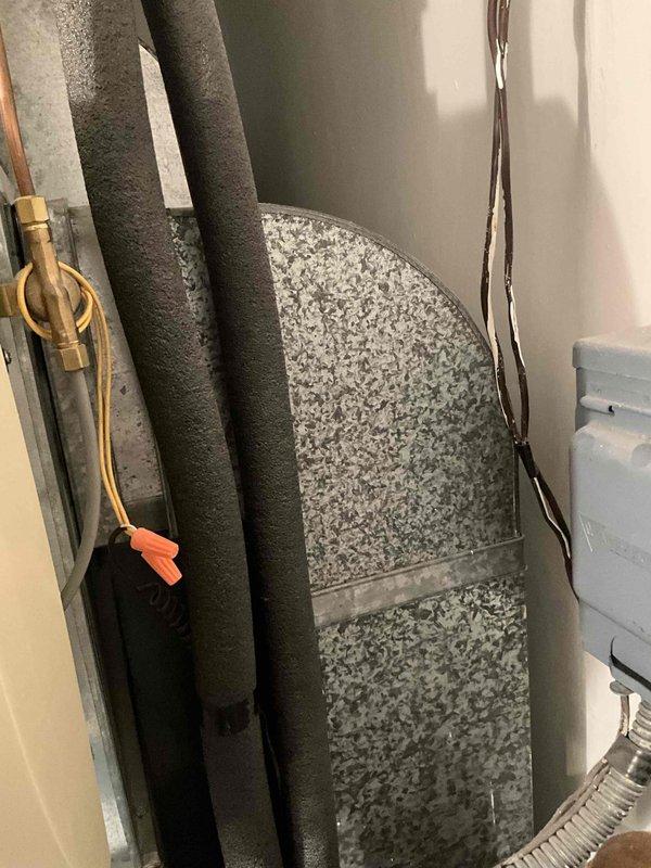 Performed on-site evaluation of 25-30 year old residential heating and air conditioning system for complete replacement estimate. Inspected existing furnace, air conditioning unit, ductwork configuration, and related mechanical components in utility space. Documented current system specifications, equipment age, installation layout, and existing infrastructure including refrigerant lines, electrical connections, and ventilation components. Assessed mechanical room dimensions and equipment accessibility to determine replacement requirements and compatibility. Photographed existing furnace with manufacturer labels, integrated air purification system, ductwork routing, refrigerant line insulation, and copper piping connections for estimate preparation. No immediate system failures or urgent operational issues identified during inspection. Provided comprehensive replacement options and recommendations based on current equipment condition and residential heating and cooling requirements.